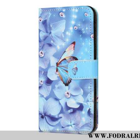 Fodral För Samsung Galaxy S24 Fe Blå Blommor Och Fjärilar Med Rem